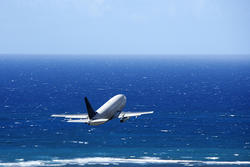 Airplane over the ocean