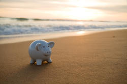 Piggy bank on a beach