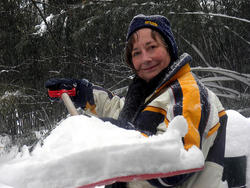 Woman shoveling snow