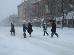 Walking down the street in a snowstorm