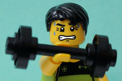 LEGO man lifting a weight