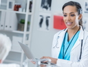 Doctor talks with patient in hospital