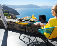 Woman working with laptop while on vacation